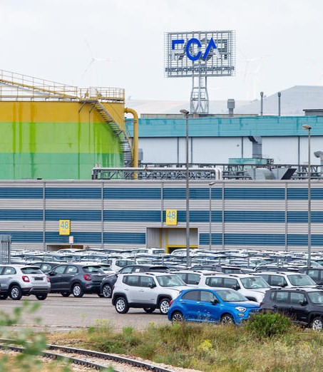 A view of the FCA factory in San Nicola di Melfi, near Potenza, southern Italy, 21 May 2020. With the first shift at 6.00 a.m., work for the seven thousand employees of the FCA factory in San Nicola di Melfi returned to full capacity during phase 2 of the coronavirus emergency. In front of the gates, in the rain, the workers entered the factory wearing protective face masks, keeping the safety distances and were subjected to body temperature measurement. ANSA/TONY VECE