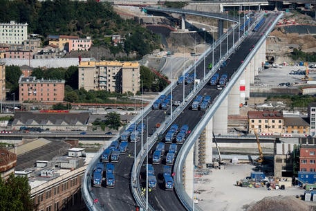 Trucks drive over the new Genoa bridge as static testing of the bridge has started, in Genoa, Italy, 19 July 2020. Eight trucks are moving on the new viaduct on the Polcevera river. The trucks entered the bridge on the east side, on the southbound carriageway, and then turned back, to continue with some maneuvers on the new structure. The new bridge is under construction after the Morandi highway bridge partially collapsed on 14 August 2018, killing a total of 43 people. 
ANSA/LUCA ZENNARO