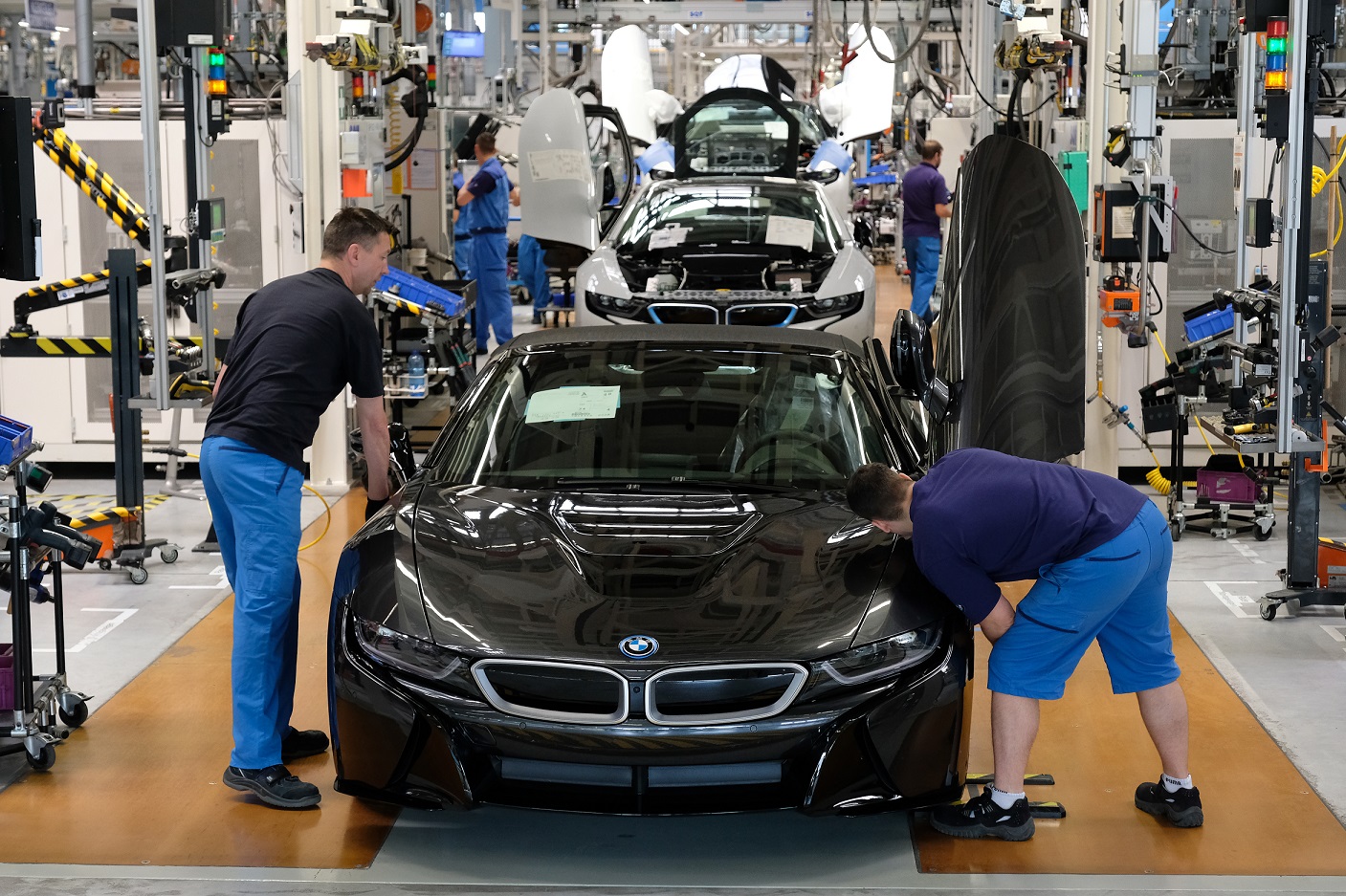LEIPZIG, GERMANY - MAY 20: Workers assemble BMW I8 hybrid cars on the assembly line at the BMW factory on May 20, 2019 in Leipzig, Germany. German President Frank-Walter Steinmeier later spoke at a gathering of the plant's workers on the importance of Europe and urged the workers to vote in upcoming European parliamentary elections. (Photo by Sean Gallup/Getty Images)