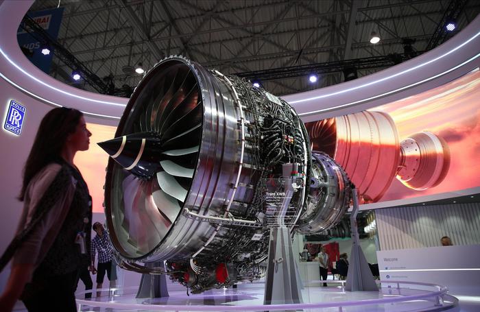 epa08003125 A visitor walks past a Trent XWB engine at the Rolls Royce pavilion during the first day of the Dubai Airshow 2019 at Al Maktoum International Airport in Jebel Ali, Dubai, United Arab Emirates, 17 November 2019. The airshow will run from 17 November to 21 November 2019.  EPA/ALI HAIDER