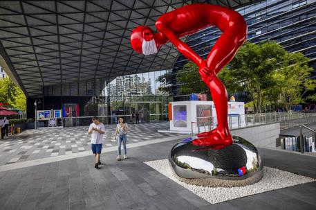epaselect epa08702963 People walk past a sculpture at the main entrance in the Ant Group headquarters in Hangzhou, China, 27 September 2020 (issued 28 September 2020). Ant Group is the parent company of China's largest mobile payments business Alipay and leading provider of financial services technology. The Alipay mobile application serves over 1 billion annual active users, according to the company. Ant Group was founded by billionaire Jack Ma, and has announced it will aim for a 30 billion US dollar initial public offering (IPO) latter this year.  EPA/ALEX PLAVEVSKI  ATTENTION: This Image is part of a PHOTO SET