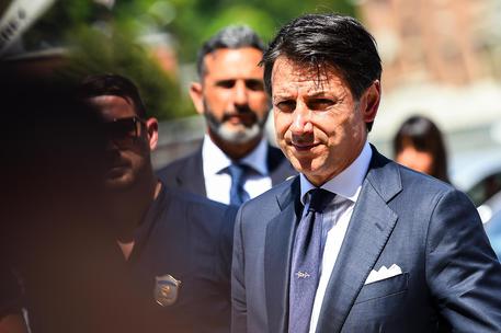 Italian Prime Minister Giuseppe Conte wears a commemorative tie as he leaves at the end of an official ceremony on the first anniversary of the Morandi highway bridge collapse, in Genoa, Italy, 14 August 2019
ANSA/SIMONE ARVEDA