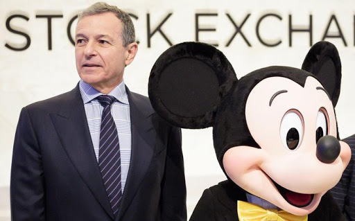 epa06354216 Bob Iger (L), the CEO of The Walt Disney Company, and company mascot Mickey Mouse stand together before ringing the opening bell of the New York Stock Exchange in New York, New York, USA, on 27 November 2017.  EPA/JUSTIN LANE