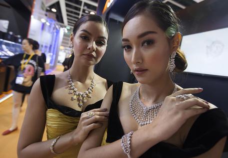 epa07018971 Models present diamond jewelry at the Hong Kong Jewelry and Gem Fair 2018, Hong Kong, China, 14 September 2018. The fair runs from 14 to 18 September 2018, and hosts 3,700 visitors from around the world, and this year is largest it has ever been during its 36 year history. According to a recent study by diamond manufacturer De Beers, Chinese millennials and those born after 1995, or Generation Z, are leading the world in buying diamonds and are fuelling demand for the glitzy gems in the worldà¢s second-largest diamond market.  EPA/ALEX HOFFORD