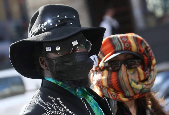 People of the audiece wearing protective face masks upon thier arrival to attendthe Dolce&Gabbana show during the Milan Fashion Week, Milan, Italy, 23 February 2020. The Fall-Winter 20/21 Women's colle?ctions are presented at the Milano Moda Donna from 18 to 24 February 2020. ANSA/MATTEO BAZZI