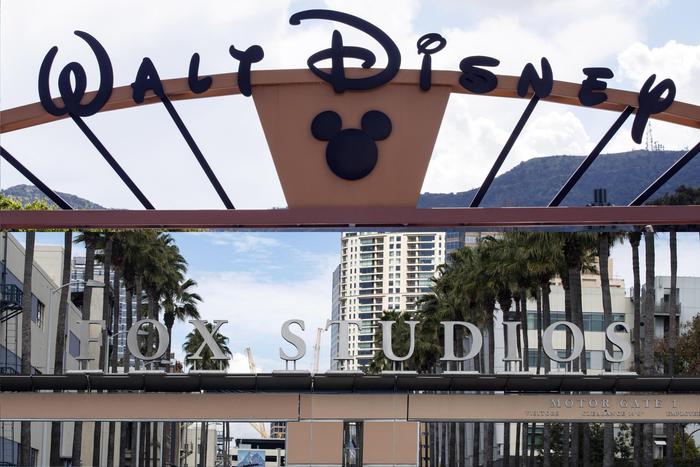 epa07451940 A combo picture shows the entrances of the Walt Disney Company (up) and the 21st Century Fox studios in Burbank and Los Angeles, California, 20 March 2019. The acquisition of 21st Century Fox by the Walt Disney Company for 71,3 billion dollars was made official today.  EPA/ETIENNE LAURENT