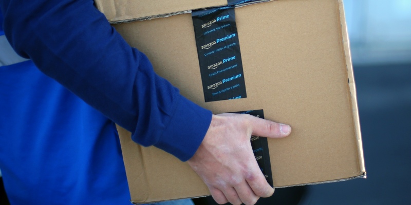 An employee carries boxes with 