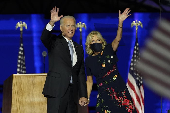 epa08806563 President-elect Joe Biden (L) with his wife Jill Biden (R) wave to supporters during celebratory event held outside of the Chase Center in Wilmington, Delaware, USA, 07 November 2020. According to media reports, Biden has defeated President Donald Trump in the 2020 USA presidential election to become the United Sates' 46th president.  EPA/Robert Deutsch / POOL