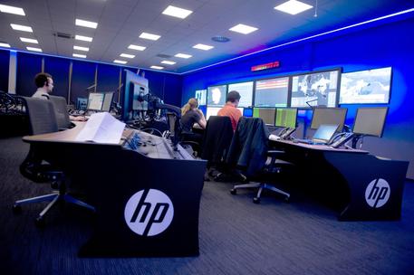epa04521584 Hewlett Packard employees work in the HPÂ cyber defence center in Boeblingen, Germany, 09Â December 2014. It will protect German clients from cyber crime in the future. The Boeblinger cyber defense center is one of nine run by HPÂ worldwide.  EPA/DANIEL NAUPOLD