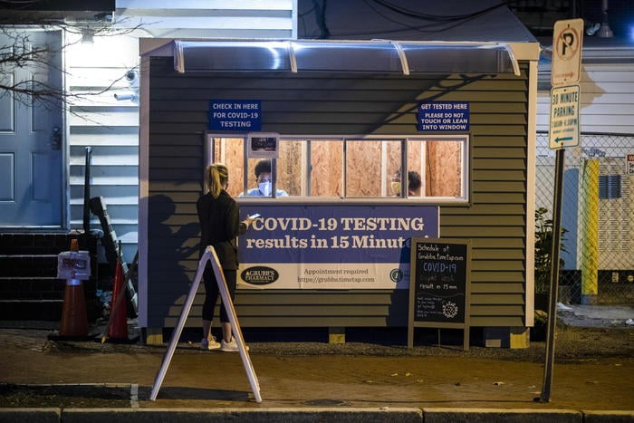 epa08908552 A temporary building outside of Grubb's Pharmacy offers COVID 19 testing with results in minutes on Capitol Hill in Washington, DC, USA, 28 December 2020. Today DC official reported 140 more COVID-19 infections and three deaths.  EPA/SHAWN THEW