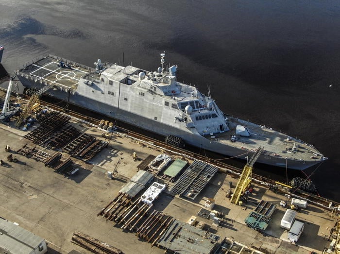 epa08507513 An aerial photo taken with a drone shows the Littorial Combat Ships USS Minneapolis-St. Paul (LCS21) at the dock at Fincantieri Marinette Marine's shipbuilding facility in Marinette, Wisconsin, USA, 24 June 2020. According to the US Navy The ships deliver advanced capability in anti-submarine, surface and mine countermeasure missions, and are designed to evolve with the changing security environment. US President Donald J. Trump is scheduled to visit the facility on 25 June.  EPA/TANNEN MAURY