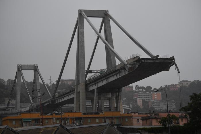 A general view of a highway bridge collapsed in Genoa, Italy, 14 August 2018. A large section of the Morandi viaduct upon which the A10 motorway runs collapsed in Genoa on early 14 August. Several people have died, rescue sources said, as both sides of the highway fell. The viaduct gave way amid torrential rain.  ANSA/LUCA ZENNARO