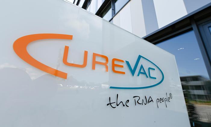 The logo of the biopharmaceutical company CureVac is seen in front of the company's headquarters in Tuebingen, southern Germany on June 23, 2020. - CureVac researches on a vaccine against the new corona virus and started a study in cooperation with the Institute of Tropical Medicine at the University Hospital in Tuebingen. (Photo by THOMAS KIENZLE / AFP)
