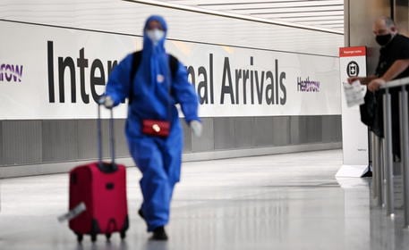 epa08941888 A Traveller arrives at Heathrow Airport in London, Britain, 16 January 2021. The UK government is implementing a closure on all travel corridors from Monday 18 January 2021. Travellers will also need to provide a negative coronavirus test to enter the country. Britain's national health service (NHS) is coming under sever pressure as Covid-19 hospital admissions continue to rise across the UK. Some one thousand people are dying each day from the Covid-19 disease.  EPA/ANDY RAIN