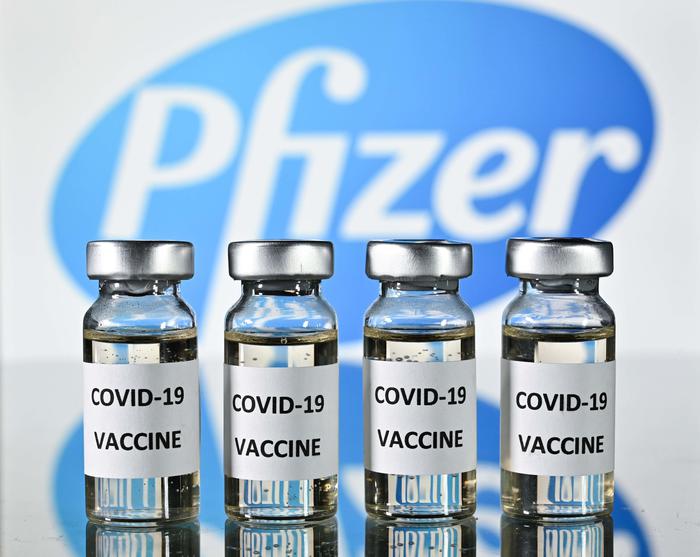 An illustration picture shows vials with Covid-19 Vaccine stickers attached, with the logo of US pharmaceutical company Pfizer, on November 17, 2020. (Photo by JUSTIN TALLIS / AFP)