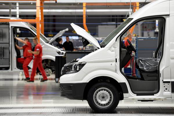 epa05600678 Employees assemble a Volkswagen Crafter van at the new Volkswagen Nutzfahrzeuge (Commercial Vehicles, VWN) factory in Wrzesnia, Poland, 24 October 2016. Volkswagen Commercial Vehicles invested roughly 800 million Euro in the 220 hectar area. Up to 3,000 employees are said to assemble the new Crafter at the factory.  EPA/RAINER JENSEN