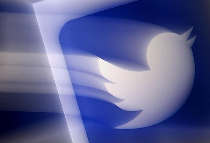 (FILES) In this file photo illustration taken on August 10, 2020 shows a Twitter logo displayed on a mobile phone in Arlington, Virginia. - As US President Joe Biden took office on January 20, 2021, Twitter handed him the reins of an official @POTUS account as part of the transfer of power. The one-to-many messaging service gave Biden's team control of all the official White House accounts, and activated a new @SecondGentleman handle for the husband of the country's first female vice president Kamala Harris. (Photo by Olivier DOULIERY / AFP)