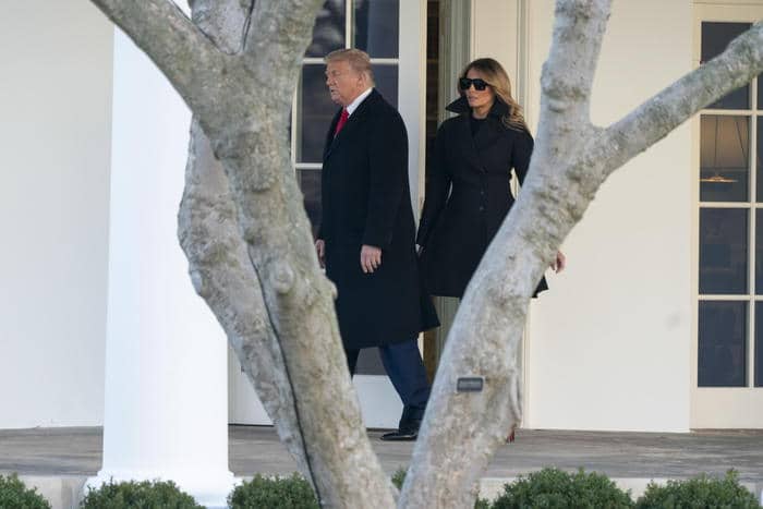 epa08901799 US President Donald J. Trump and First lady Melania Trump (R) depart the White House, in Washington, DC, USA, 23 December 2020, headed out to Mar-a-Lago in Palm Beach, Florida.  EPA/Chris Kleponis / POOL