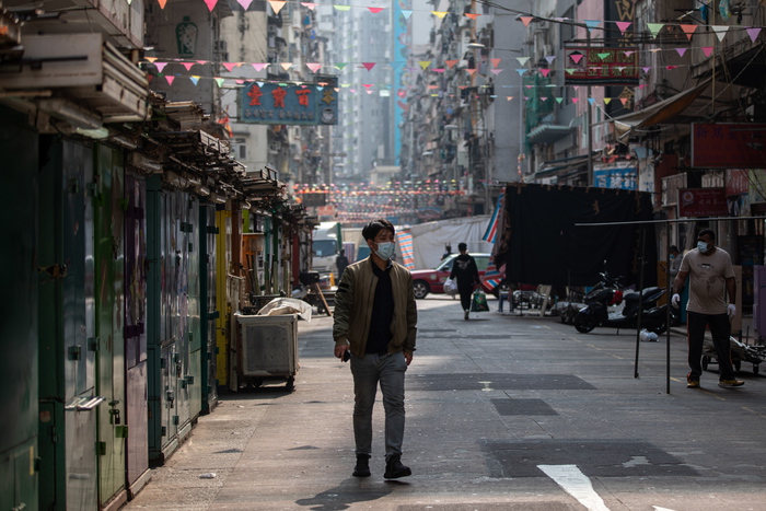 epa08956959 A man walks in a market in Jordan district in Hong Kong, China, 22 January 2021. The Hong Kong government will place tens of thousands in lockdown in the districts of Jordan and Yau Ma Tai in a bid to contain the outbreak of coronavirus and COVID-19 disease.  EPA/JEROME FAVRE