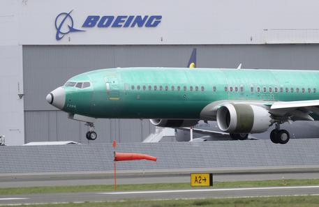 FILE - In this April 10, 2019, file photo a Boeing 737 MAX 8 airplane being built for India-based Jet Airways lands following a test flight at Boeing Field in Seattle. Boeing Co. reports earnings Wednesday, April 24. (ANSA/AP Photo/Ted S. Warren, File) [CopyrightNotice: Copyright 2019 The Associated Press. All rights reserved.]