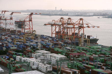 epa08126390 A view of containers being unloaded from a ship as another vessel enters a wharf at Aomi international container terminal in Tokyo, Japan, 14 January 2020. The current account surplus of Japan increased 75 percent in November 2019 from a year earlier to reach around 1.44 trillion yen (about 13 billion US dollar); the 65th consecutive month increase, the Finance Ministry announced on 14 January 2020.  EPA/KIMIMASA MAYAMA