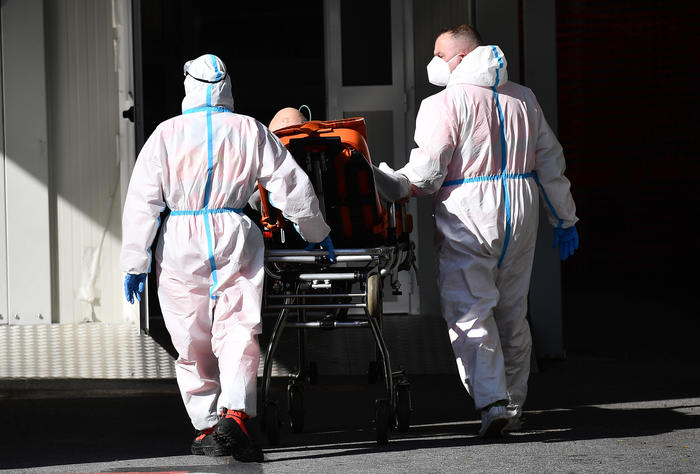 Some health workers transfer a patient in an ambulance to the emergency department of San Martino Hospital, during the pandemic of Covid-19, Genoa, Italy, 11 February 2021.  ANSA/LUCA ZENNARO