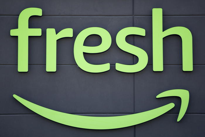 epa08632982 The logo Amazon Fresh at the entrance of the supermarket in Woodland Hills, California, USA, 28 August 2020. On 26 August, Amazon Fresh opened its first store in the USA.  EPA/ETIENNE LAURENT