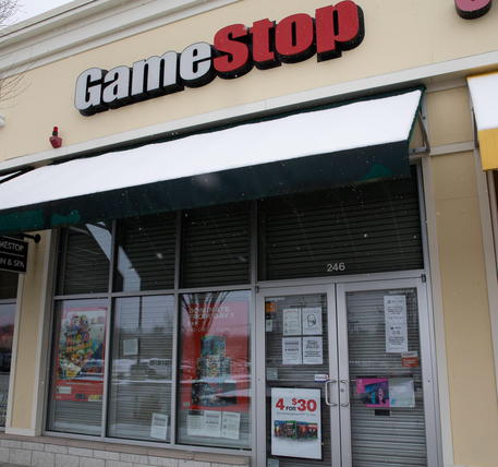 epa08971316 A GameStop location in Wilmington, Massachusetts, USA, 28 January 2021. The electronic game retailer has seen it's stock price soar from 3.25 US dollars in April 2020 to close at 347.51 US dollars on 27 January. The company has drawn interest from investors in online chat groups and created as much as 3 billion US dollars in value losses for short sellers.  EPA/CJ GUNTHER