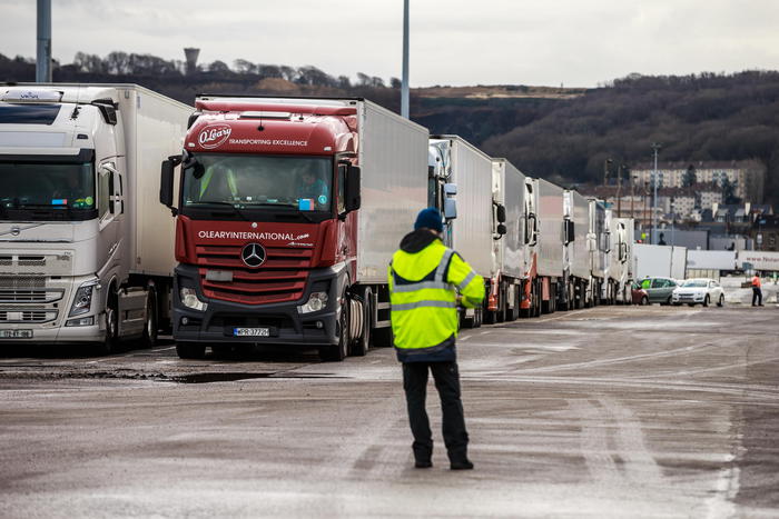 Employees of the port of Cherbourg prepare to load trucks on a ferry operated by Irish Ferries to Rosslare Port in Ireland at the port of Cherbourg, Normandy region, France, 04 February 2021 (issued 05 February 2021). Brexit has triggered the direct transport of trucks between Ireland and France, trying to avoid the long bureaucratic procedures involved in entering and leaving British soil. The French city of Cherbourg saw in January 2021 the traffic of trucks leaving or entering on board ferries to Ireland tripled compared to the same month of 2020 (9,000 compared to 3,000), according to General Manager of Cherbourg Harbour Yannick Millet. Typically some 150,000 trucks use the so-called 'land bridge' each year to cross from Ireland to the mainland via the UK, said president of the West Normandy Chamber of Commerce for Industry Dominique Louzeau, and Cherbourg could capture around 20-25 percent of that volume, in addition to its regular traffic, among the carriers seeking to avoid stricter customs and sanitary controls. There are currently 15 weekly heavy vehicle ferry frequencies between Cherbourg and Ireland (the ports of Rosselare and Dublin), up from six in December 2020.  ANSA/CHRISTOPHE PETIT TESSON  ATTENTION: This Image is part of a PHOTO SET