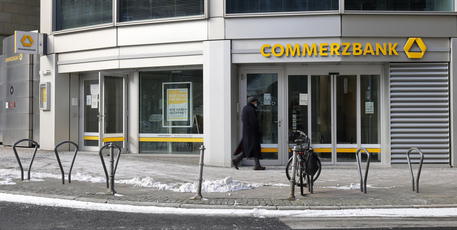 epa08998399 An exterior view of the entrance of a Commerzbank branch in Frankfurt am Main, Germany, 09 February 2021. Commerzbank will release their preliminary business figures for the fourth quarter Q4 and the full year 2020 on 11 February 2021.  EPA/RONALD WITTEK