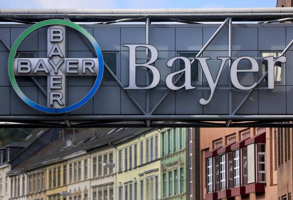 epa05542070 A Bayer logo at the facade of a pedestrian bridge in front of the factory of Bayer corporation in Wuppertal, Germany, 16 September 2016. The German chemical giant and its rival US Monsanto in a statement released 14 September 2016 said they had signed a definite merger agreement. Bayer and Monsanto said  Bayer will acquire Monsanto for 128 USD per share in an all-cash transaction as part of a deal that amounts to some 66 billion USD. It is the largest such deal ever involving a German company as a buyer. The takeover would create a global market leader that would have more than 25 per cent of global pesticides and seeds market.  EPA/OLIVER BERG