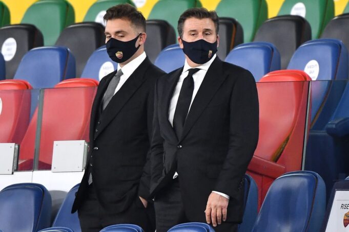 As Roma's US President Thomas Daniel Friedkin (R) and his son Ryan Friedkin, wearing face masks, look on before the Italian Serie A football match Roma vs Benevento at Olympic stadium in Rome, on October 18, 2020. (Photo by Tiziana FABI / AFP) (Photo by TIZIANA FABI/AFP via Getty Images)