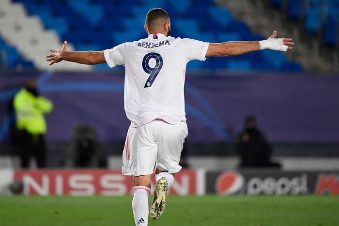 Real Madrid's French forward Karim Benzema celebrates his goal  during the UEFA Champions League group B football match between Real Madrid and Inter Milan at the Alfredo di Stefano stadium in Valdebebas, on the outskirts of Madrid, on November 3, 2020. (Photo by PIERRE-PHILIPPE MARCOU / AFP)