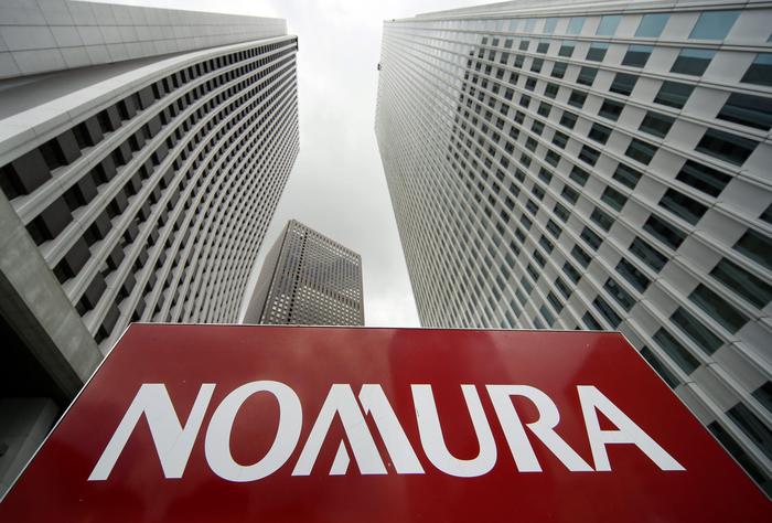 epa03454627 (FILE) A file photo dated 01 August 2012 of the logo of the Nomura Holdings Inc. seen at the company's Shinjuku building in Tokyo, Japan. Nomura Holdings, largest brokerage in Japan,  has been fined for insider trading 01 November 2012 by the Tokyo stock exchange. The fine of 2,5 million USD is the largest ever given by the exchange. Reports state, information about share sales were given to customers by Nomura employees before they were made public.  EPA/KIMIMASA MAYAMA