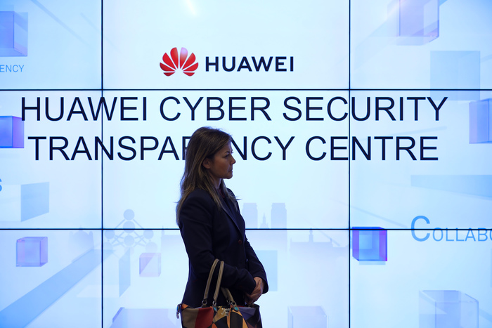 (200131) -- BEIJING, Jan. 31, 2020 (Xinhua) -- A woman listens to a debate at Huawei Cyber Security Transparency Center in Brussels, Belgium, on Jan. 30, 2020. Huawei held the debate on 5G cyber security toolbox on Thursday, following the issuance of the EU 5G 