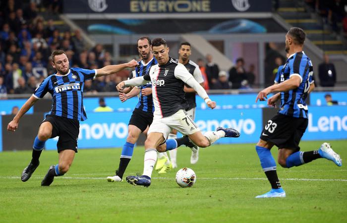 Juventus' Cristiano Ronaldo  (C) scores (but the goal is disallowed by referee Gianluca Rocchi for an offside of Paulo Dybala, not pictured) during the Italian serie A soccer match between FC Inter and Juventus FC  at Giuseppe Meazza stadium in Milan 6 October 2019.
ANSA / MATTEO BAZZI