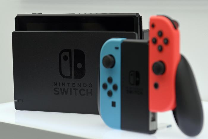 epa06489085 (FILE) - The game console Nintendo Switch is on display during the Nintendo Switch Presentation 2017 in Tokyo, Japan, 13 January 2017 (reissued 01 February 2018). On 01 February 2018, Nintendo Co. raised its profit outlook thanks to strong sales of its Nintendo Switch gaming console. Nintendo already sold a total of 14.9 million Switch consoles since March 2017 with strong sales during the yearend holiday period.  EPA/FRANCK ROBICHON