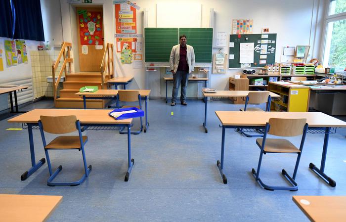 German school director Juan Carlos Boeck stands in a classroom on May 4, 2020 a few days before the reopening of the Petri primary school, in Dortmund, western Germany, amid the new coronavirus Covid-19 pandemic. - The primary schools in North Rhine-Westphalia are to reopen on May 7, 2020 as planned for fourth-graders. (Photo by Ina FASSBENDER / AFP)