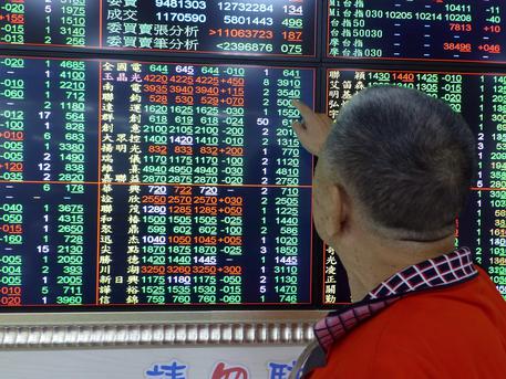 epa07758956 A man watches a monitor at a stock exchange in Taipei, Taiwan, 06 August 2019. Asiian stocks tumbled over as US Treasury department formally label China as a currency manipulator, after China's Renminbi fell through the key threshold of seven to the dollar on 05 August, amid escalation of US-China trade war. Major Asian stocks fell more than two per cent with Taiwan's TAIEX falling 2.4 per cent within three minutes of the stock market's opening.  EPA/DAVID CHANG