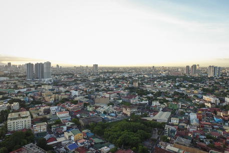 epa08978916 An image taken with a drone shows a view of San Juan City and its neighboring cities in San Juan City, Manila, Philippines, 31 January 2021 (issued 01 February 2021). Authorities have extended the lockdown to Metro Manila and other provinces to another month as preventive measures in slowing down the spread of the coronavirus.  EPA/MARK R. CRISTINO