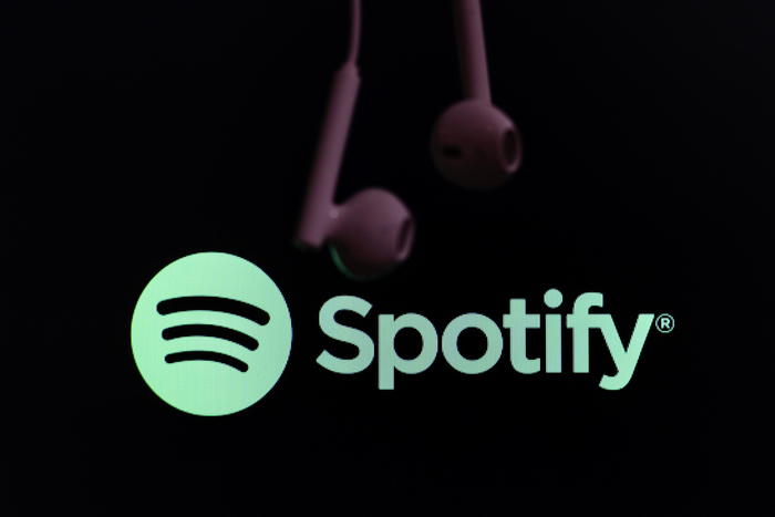 epa08573690 The logo of music streaming company Spotify is pictured next to an earphone in Taipei, Taiwan, 30 July 2020. The Stockholm-based company released its second quarter revenue results on 29 July 2020.  EPA/RITCHIE B. TONGO
