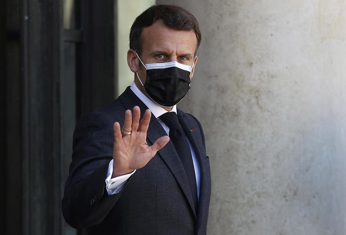 epa09106586 French President Emmanuel Macron seen at the Elysee Palace in Paris, France, 30 March 2021. Macron is expected to make a televised statement to the nation on Wednesday 31 March tto address the current Covid19 coronavirus pandemic in France which is being referred to as the third wave with surging cases across the country.  EPA/IAN LANGSDON