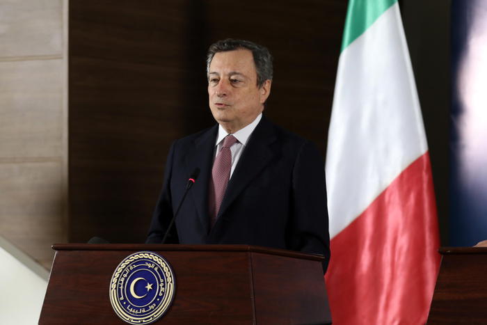 epa09118145 Italian Prime Minister Mario Draghi gives a joint press conference with Libya's interim prime minister Abdul Hamid Dbeibah  (not pictured) at the prime minister's office in Tripoli, Libya on 06 April 2021.  EPA/STR