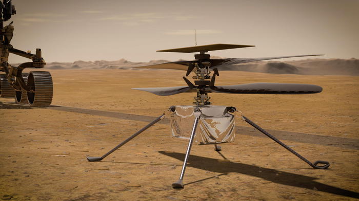 epa09112949 An undated handout artist's concept made available by NASA shows the Ingenuity Helicopter detached from NASA's Perseverance Mars rover, issued 03 April 2021. The helicopter is expected to fly in a dedicated fly zone no earlier than 08 April. Having landed on Mars on 18 February, Perseverance's main mission on Mars is astrobiology and the search for signs of ancient microbial life, according to NASA.  EPA/NASA/JPL-Caltech HANDOUT  HANDOUT EDITORIAL USE ONLY/NO SALES