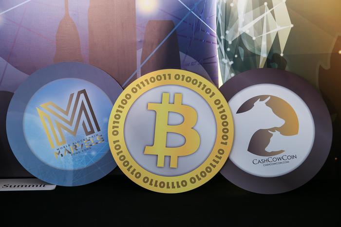 epa06967828 Logos of cryptocurrencies are displayed during the World Blockchain Marvels in Hong Kong, China, 24 August 2018. The summit on cryptocurrencies runs from 23 to 24 August.  EPA/JEROME FAVRE