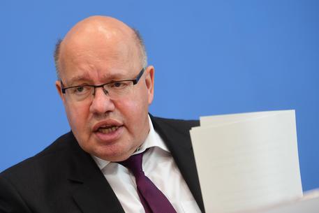 epa07927433 German Minister of Economy and Energy Peter Altmaier speaks during a press conference on the planned economic projection of the German Government for this autumn, in Berlin, Germany, 17 October 2019. Media report, that the German government doesnà¢t expect an economic crisis despite a significant economical downswing.  EPA/CLEMENS BILAN
