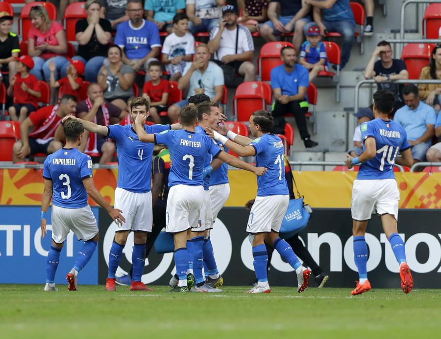 Italy players celebrate after Mali's Ibrahima Kone scores an own goal past his goalkeeper during the quarter final match between Italy and Mali at the U20 World Cup soccer in Tychy, Poland, Friday, June 7, 2019. (ANSA/AP Photo/Sergei Grits) [CopyrightNotice: Copyright 2019 The Associated Press. All rights reserved.]