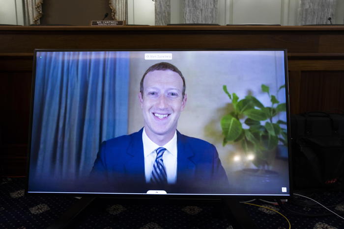 epa08780767 CEO of Facebook Mark Zuckerberg appears on a monitor as he testifies remotely during the Senate Commerce, Science, and Transportation Committee hearing 'Does Section 230's Sweeping Immunity Enable Big Tech Bad Behavior?', on Capitol Hill in Washington, DC, USA, 28 October 2020. CEO of Twitter Jack Dorsey; CEO of Alphabet Inc. and its subsidiary Google LLC, Sundar Pichai; and CEO of Facebook Mark Zuckerberg all testified virtually at the hearing. Section 230 of the Communications Decency Act guarantees that tech companies can not be sued for content on their platforms, but the Justice Department has suggested limiting this legislation.  EPA/MICHAEL REYNOLDS / POOL