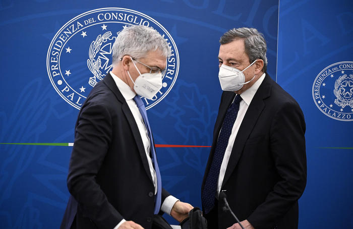 Italian Prime Minister Mario Draghi (R) and Minister of Economy Daniele Franco (L) attend a press conference after the Cabinet Meeting on economic measures to fight the Covid-19 pandemic crisis, Rome, Italy, 19 March 2021. ANSA/RICCARDO ANTIMIANI
