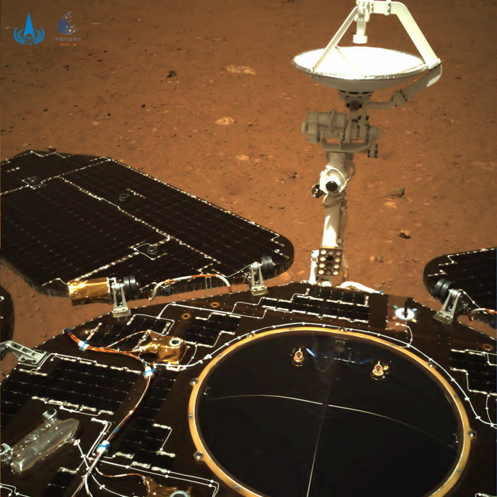 epa09214013 A handout photo made available by the China National Space Administration (CNSA) on 19 May 2021 shows an image taken by the navigation camera fitted to the rear of the of China's Zhurong rover on the surface of Mars, showing the rover's solar panels and antenna (issued 20 May 2021). China's Zhurong rover transmits first two images from Mars after successfully landing on the planet on 15 May 2021.  EPA/China National Space Administration / HANDOUT  HANDOUT EDITORIAL USE ONLY/NO SALES